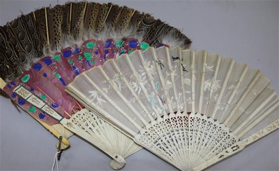 Two feather fans and an embroidered fan